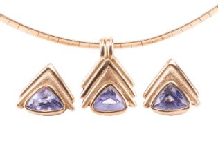 A tanzanite pendant and earrings suite, featuring trillion-cut tanzanites set in chevron-style