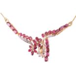 A ruby and diamond necklace; the centre set with foliate sprays of round brilliant cut diamonds and 