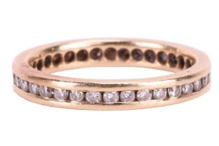 A diamond eternity ring, channel-set with an array of brilliant-cut diamonds in a flat-edged band,