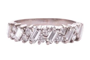 A half-eternity diamond-set ring, claw set with pairs of round brilliant diamonds between baguette-