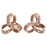 A pair of diamond-set knot earrings, with ridged texture and embellished with single-cut diamonds, s