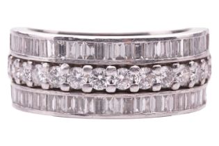 A three-row diamond dress ring in platinum, retailed by Hancocks, containing three rows of round