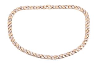 A fancy curb link necklace in 18ct bi-coloured gold, alternating with gold and white gold links with