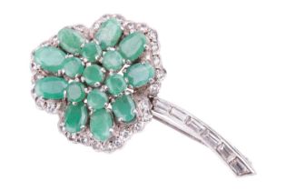 An emerald-set shamrock brooch, the oval mixed-cut emeralds centrally set in a trefoil pattern,