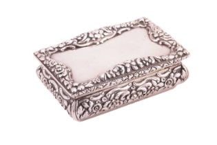 A Victorian silver snuff box; rectangular, with applied cast foliate border, curved chased sides,