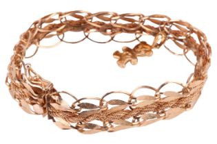 A fancy link bracelet with a removable teddy bear charm, of textured foliate design and a twisted