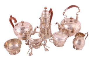 Elkington & Co. A six-piece tea and coffee set including a tea kettle on the stand; the teapot and