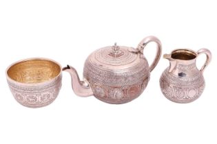 A Victorian silver bachelor's three-piece silver "Zodiac" teaset, London 1885 by George Fox, The