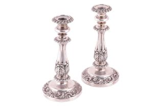 A pair of George IV silver candlesticks, by S C Younge & Co., Sheffield 1823, each cast and