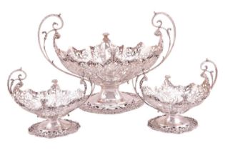 A heavy silver boat form table garniture, London 1912 & 1915 by Mappin & Webb, the set comprising
