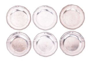 A set of six silver dinner plates, by Sebastian & James Crespell, London 1764, of circular shape,