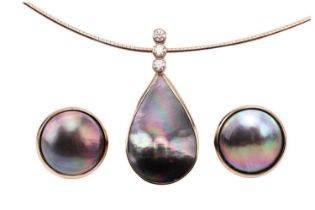 A Tahitian mabé pearl necklace and earrings set; the pendant features a teardrop-shaped mabé pearl