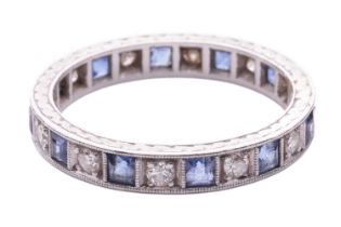 A sapphire and diamond eternity ring, alternating with square table-cut sapphires and transitional-