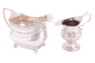 Two George III silver cream jugs; including a baluster stemmed jug, by William Cripps, London