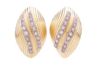 A pair of earrings set with old-cut diamonds, of ridged seashell form, highlighted with two lines of
