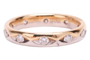 A diamond wedding band in 18ct bi-coloured gold, set with ten brilliant-cut diamonds with an