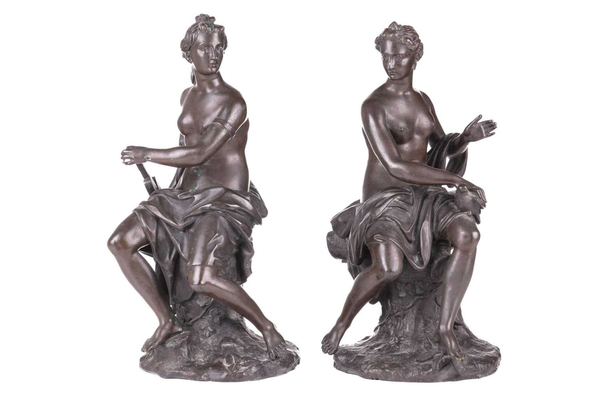 After Guillaume Coustou, a pair of seated Allegorical figures, one signed Coustou, bronze, 39 cm hig