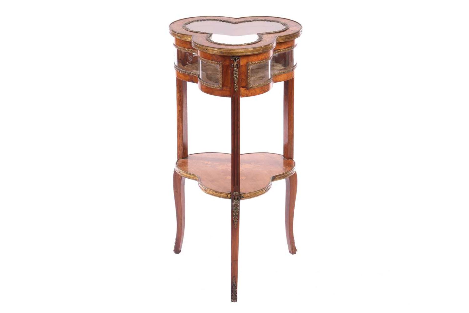A Napoleon III walnut and marquetry "Club" shaped bijouterie table, with gilt metal mounts throughou