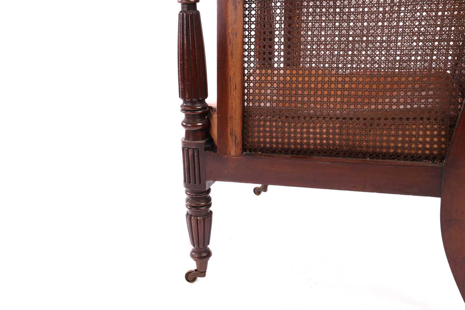 A William IV mahogany bergere library armchair, in the manner of Gillow of Lancaster with square spl - Image 4 of 18