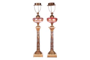 A pair of 19th-century French onyx, gilt metal and champléve enamel oil lamp bases of Corinthian