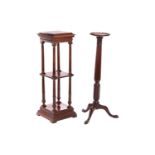 An Edwardian mahogany two-tier pedestal of architectural, form with dentil moulding and fluted colum