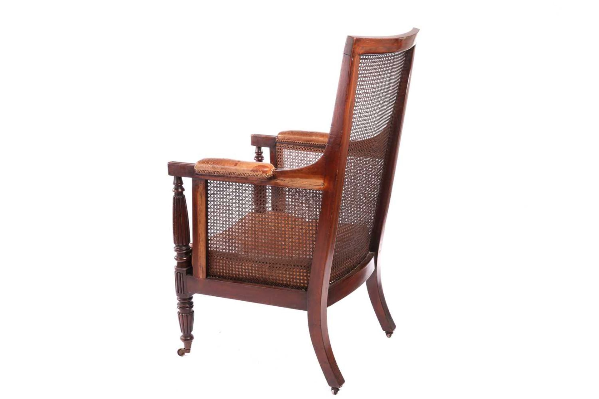 A William IV mahogany bergere library armchair, in the manner of Gillow of Lancaster with square spl - Image 6 of 18