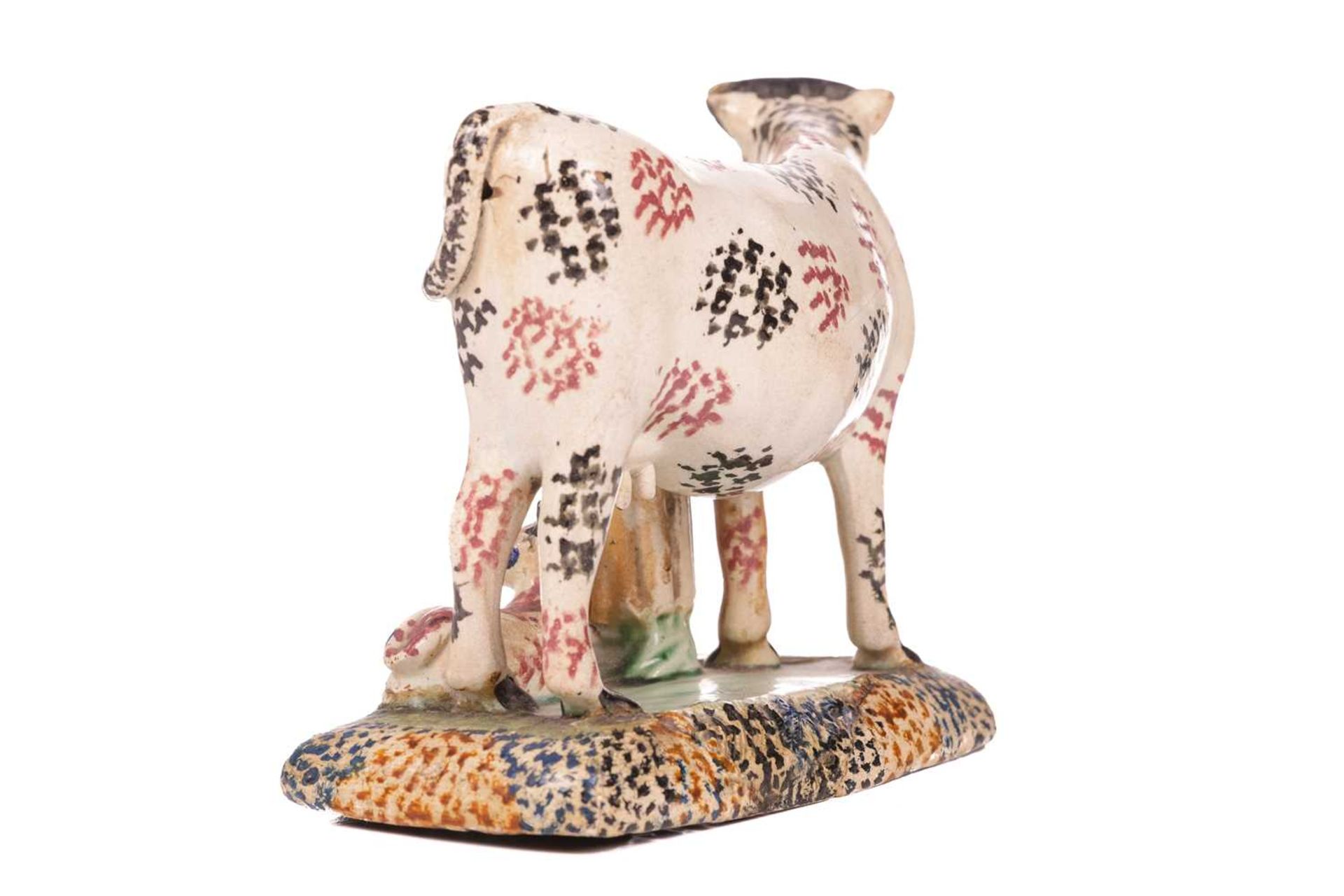 An early 19th-century Prattware ceramic cow, milkmaid and calf figure, circa 1810 with sponged decor - Image 7 of 7