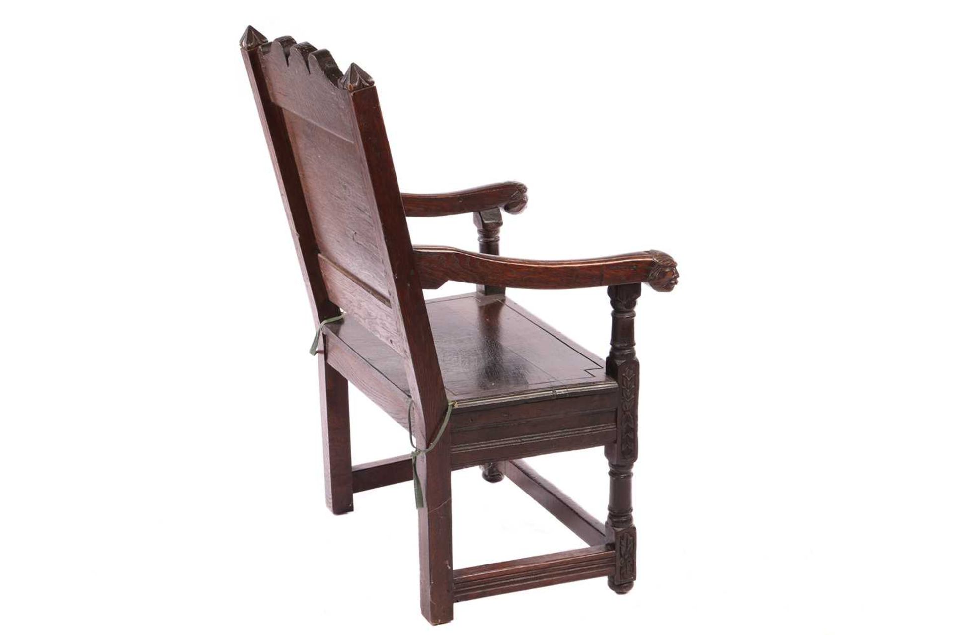 An oak wainscot armchair, 17th century and later, with carved decoration, the arms terminating in ca - Image 5 of 26