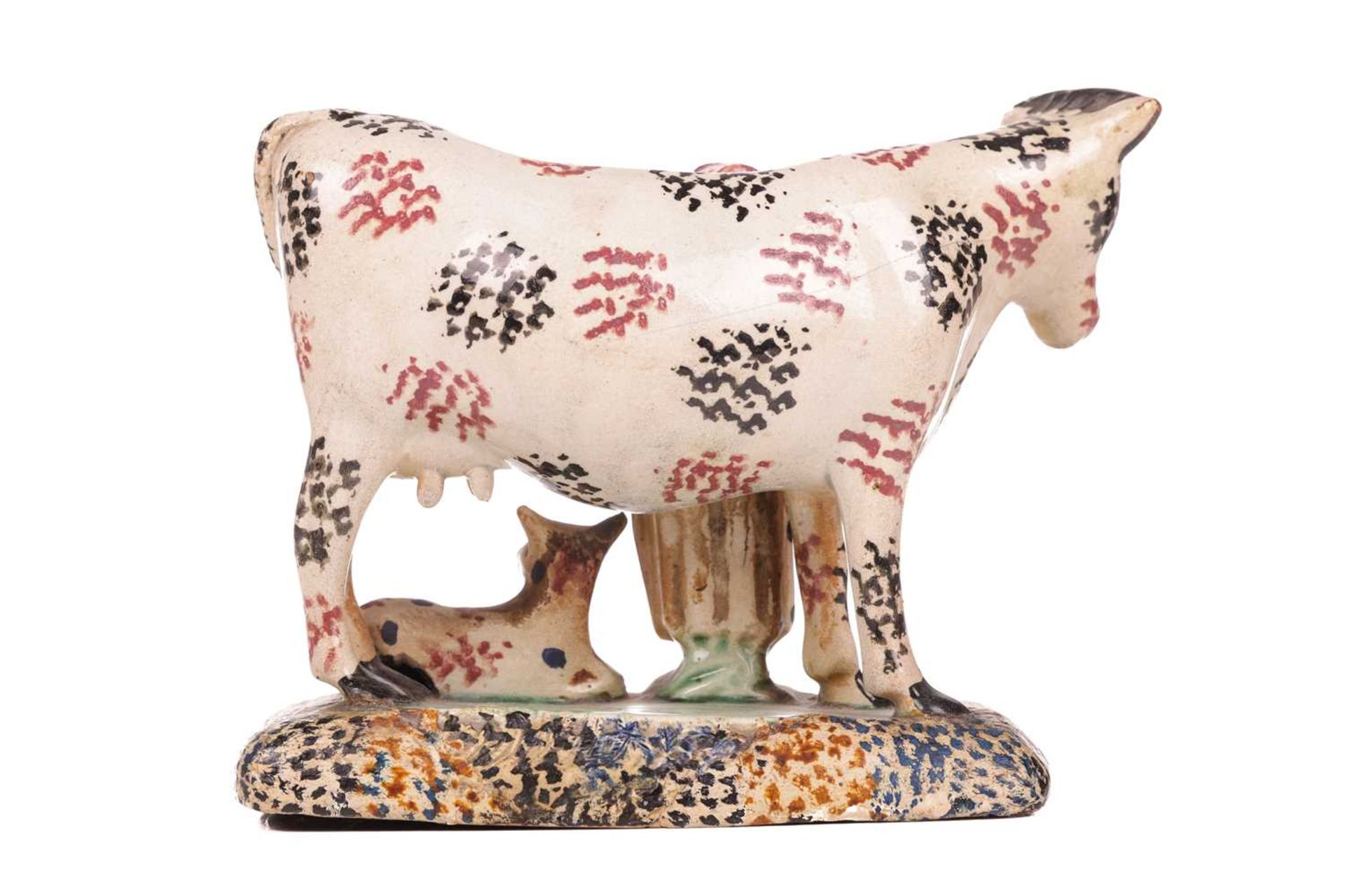 An early 19th-century Prattware ceramic cow, milkmaid and calf figure, circa 1810 with sponged decor - Image 2 of 7