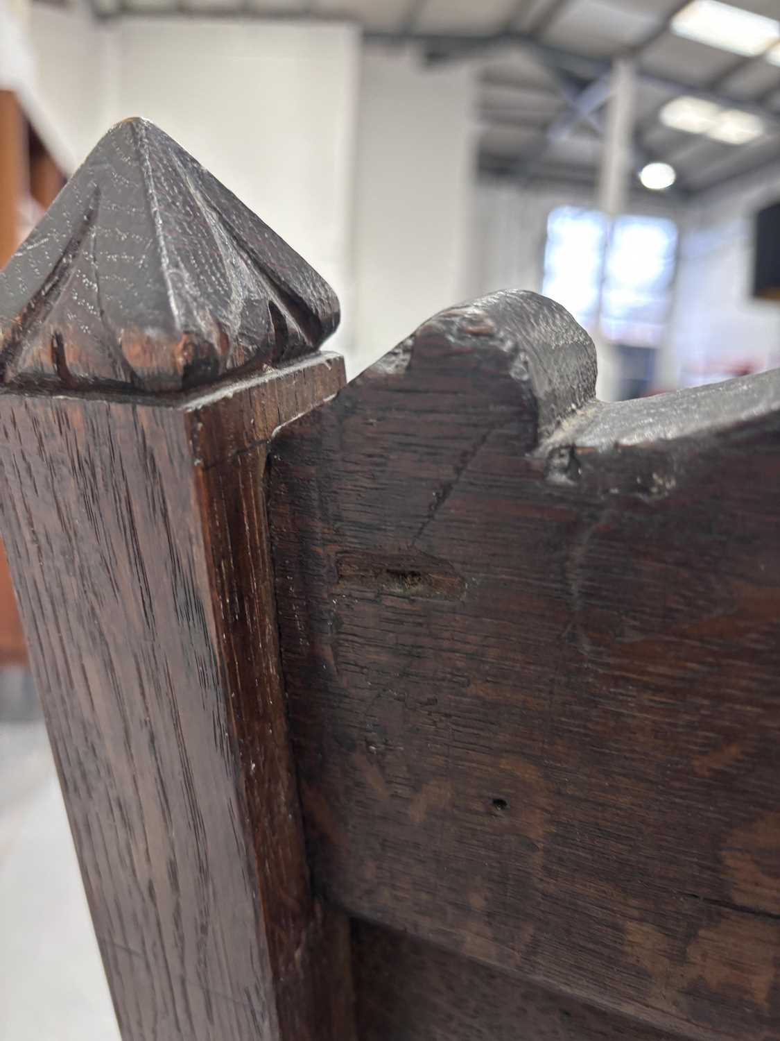 An oak wainscot armchair, 17th century and later, with carved decoration, the arms terminating in ca - Image 21 of 26