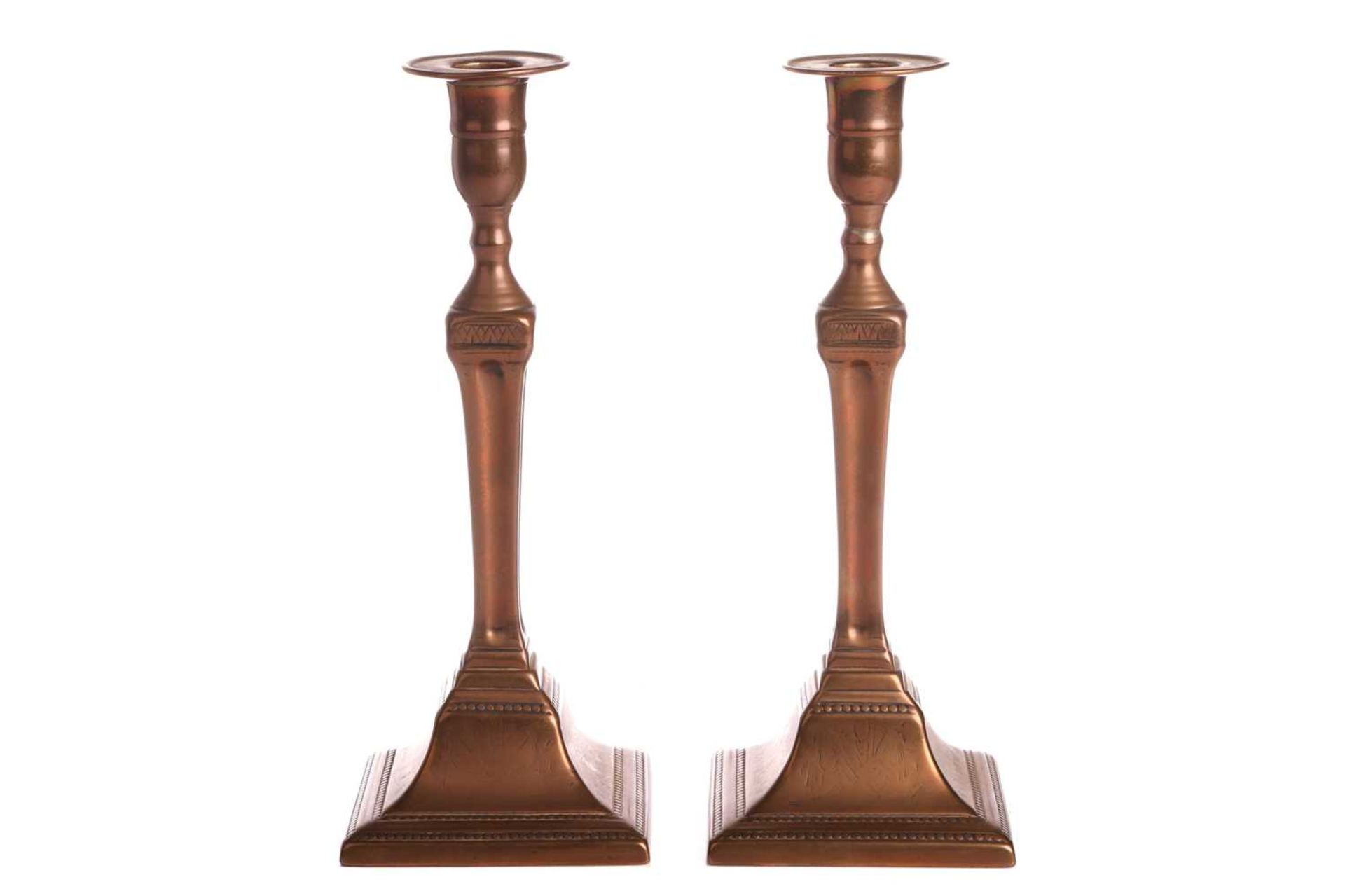 A pair of George III Great Seige of Gibraltar gunmetal candle sticks by T. Warner cast from the cano