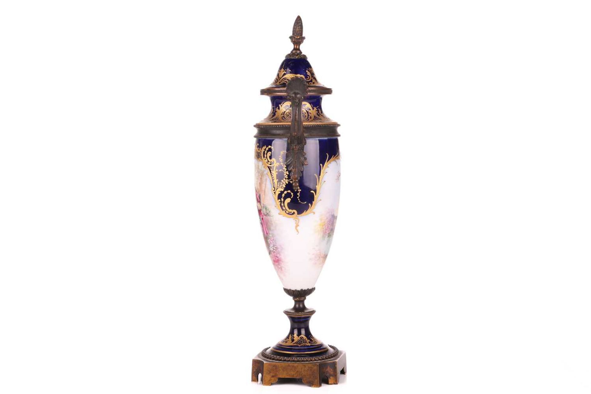 A 19th-century Sevres porcelain vase and cover, decorated with a courting couple, a chateau and lake - Image 3 of 6