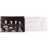 The Beatles: a black and white photographic postcard, signed verso by Paul McCartney, John Lennon, R