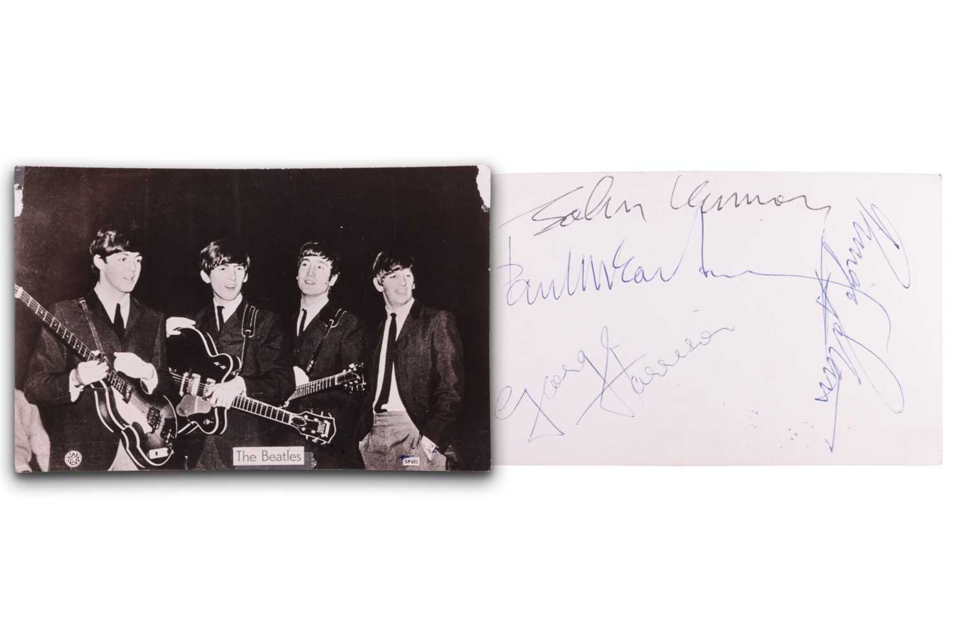 The Beatles: a black and white photographic postcard, signed verso by Paul McCartney, John Lennon, R