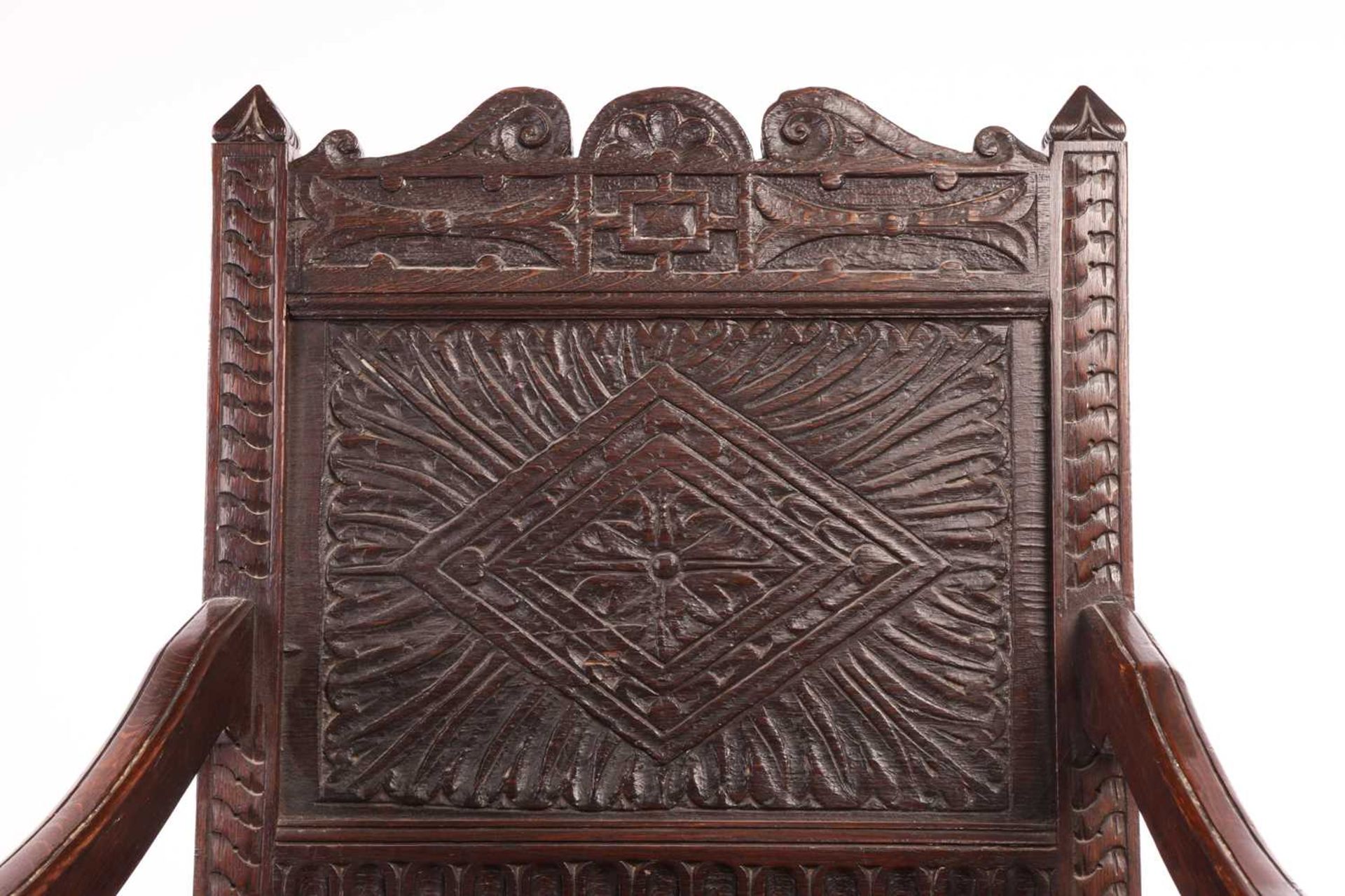 An oak wainscot armchair, 17th century and later, with carved decoration, the arms terminating in ca - Image 3 of 26