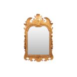 In the Manner of James Moore; A George I carved wood gilt gesso wall mirror, with broken arch pedime