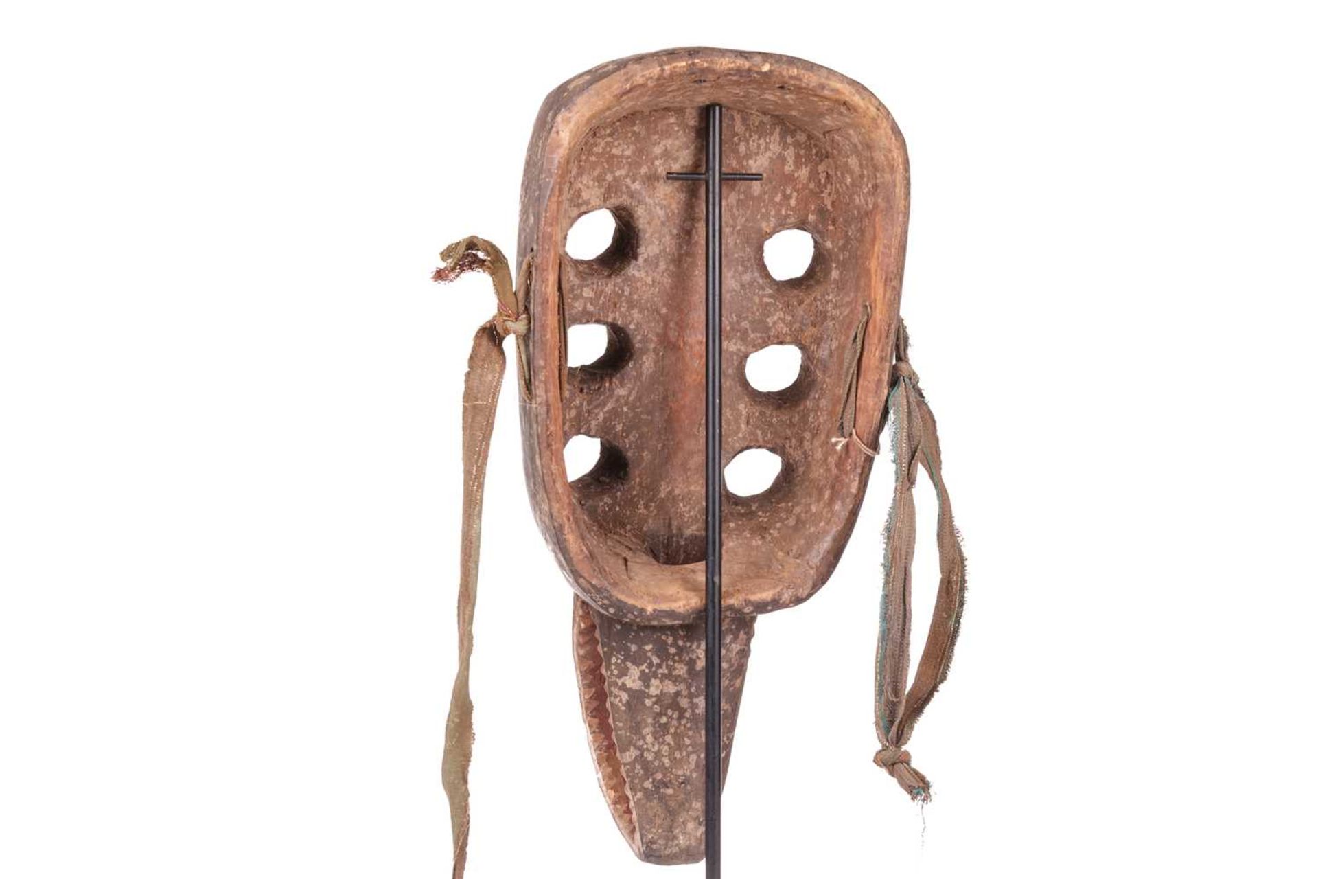 A Grebo ‘Kru’ mask, mid-20th century, 44 cm x 21 cm. NB: Display stand is for illustrative purposes  - Image 3 of 7