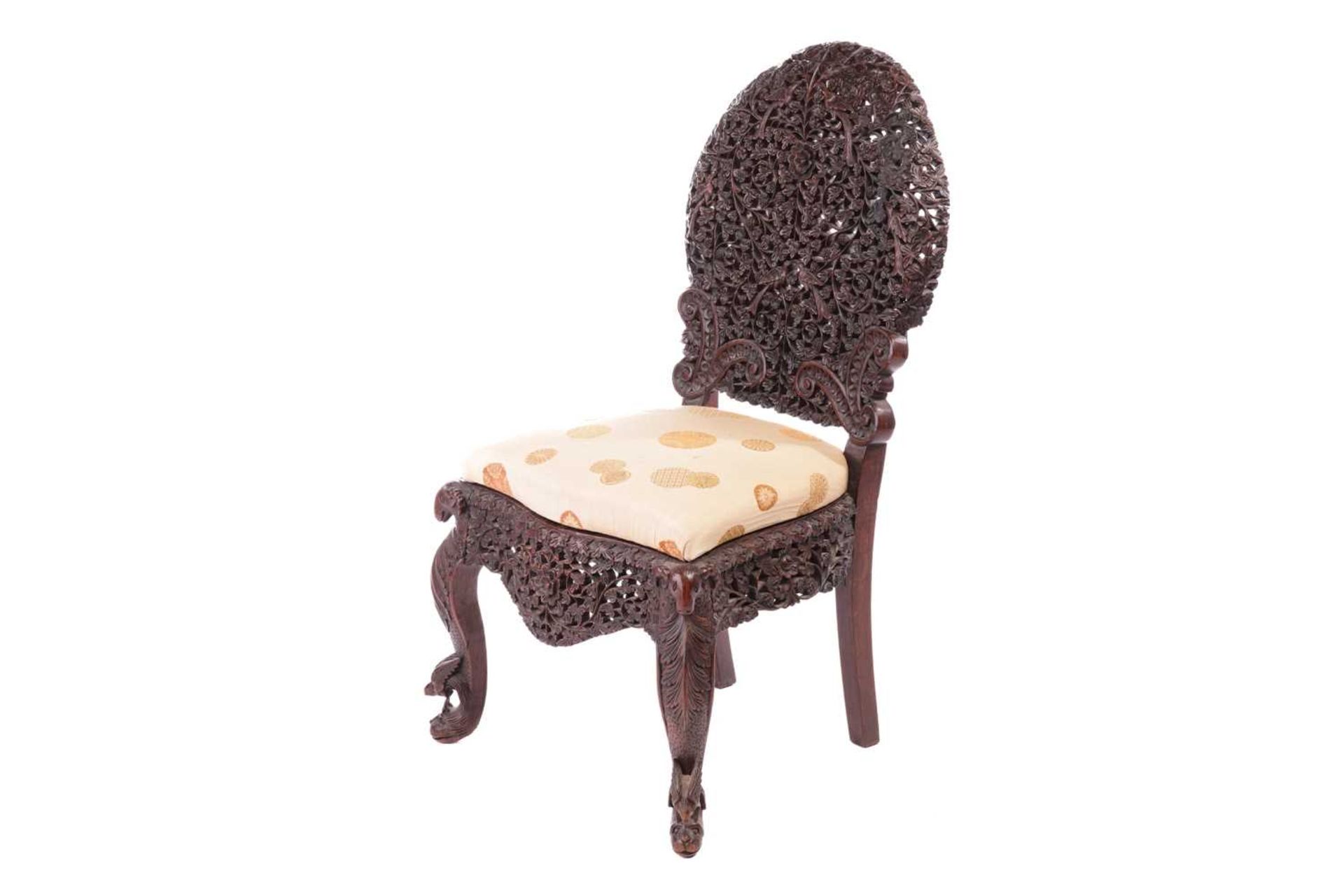 An Indian 'Bombay Carved' padauk slipper chair 19th century, the arched back pierced and carved with - Image 3 of 13