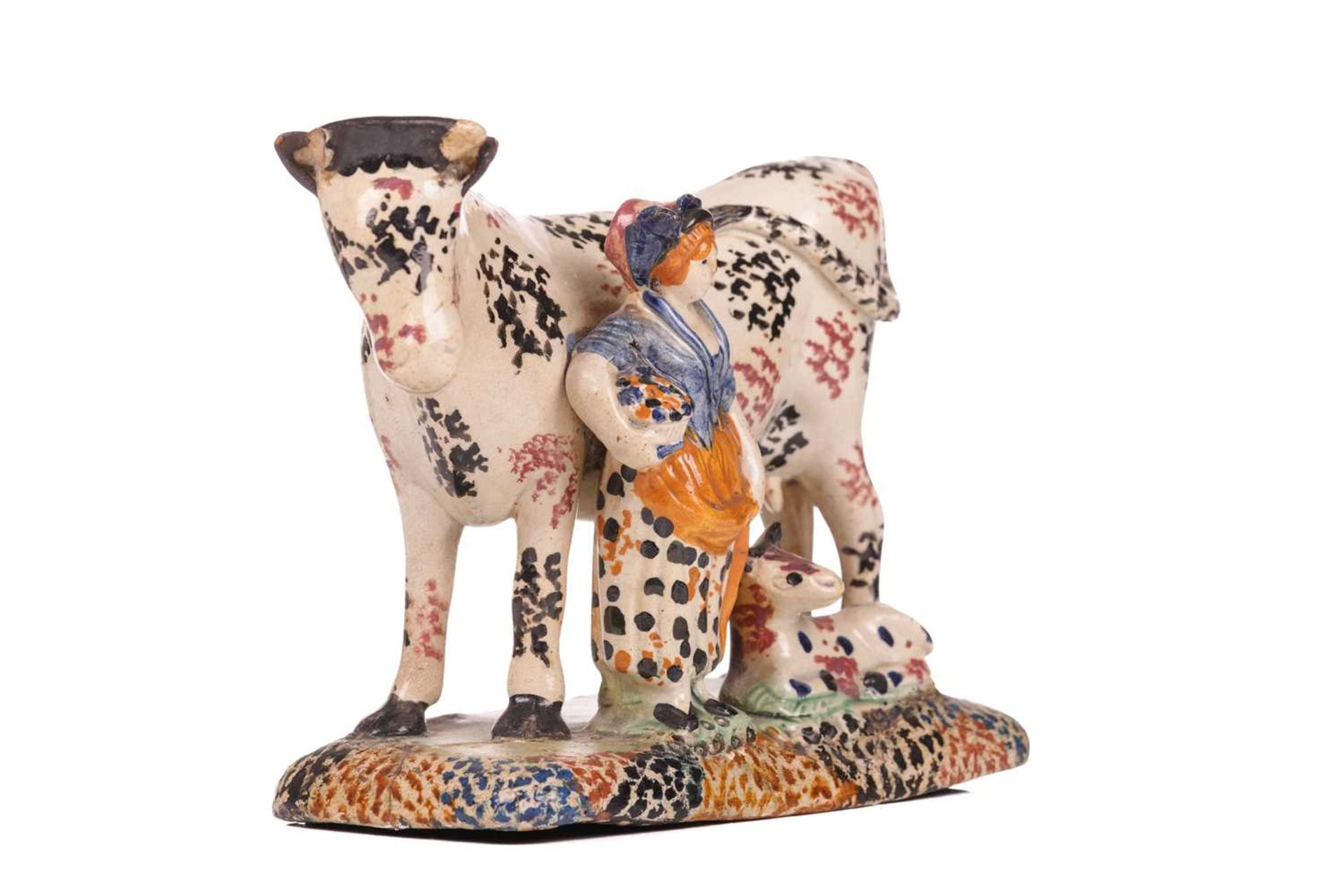 An early 19th-century Prattware ceramic cow, milkmaid and calf figure, circa 1810 with sponged decor - Image 3 of 7