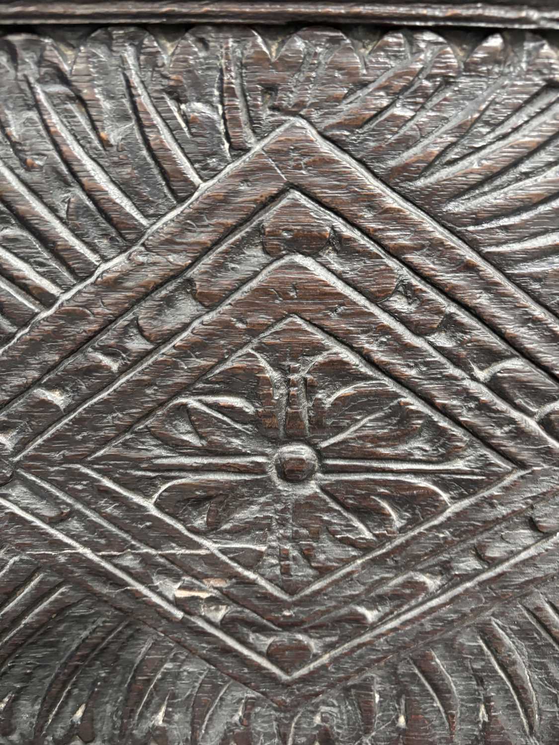 An oak wainscot armchair, 17th century and later, with carved decoration, the arms terminating in ca - Image 20 of 26