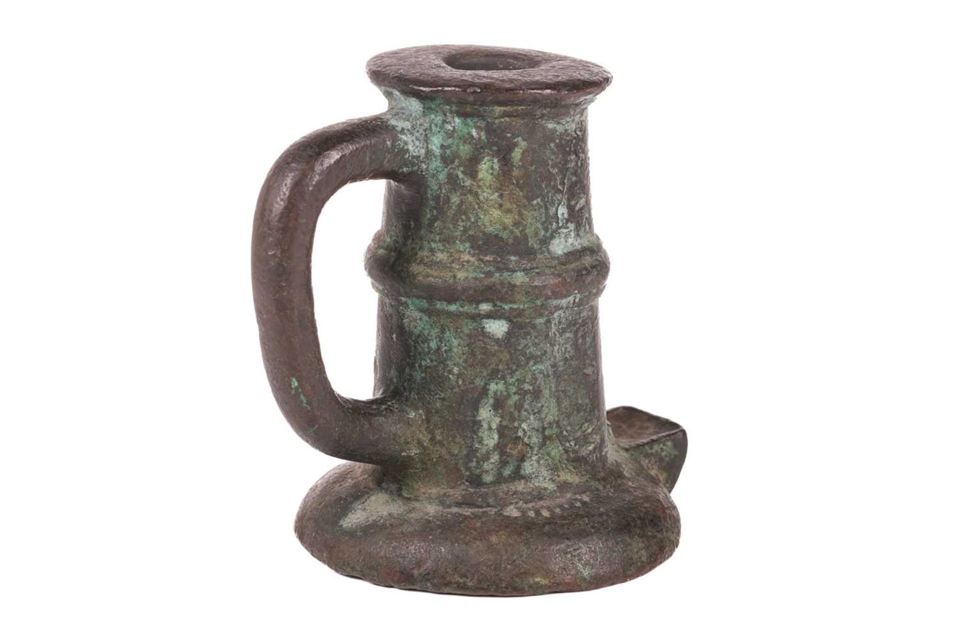 A 17th or 18th-century bronze thunder mug (signal cannon), with loop handle and ribbed centre, on a 