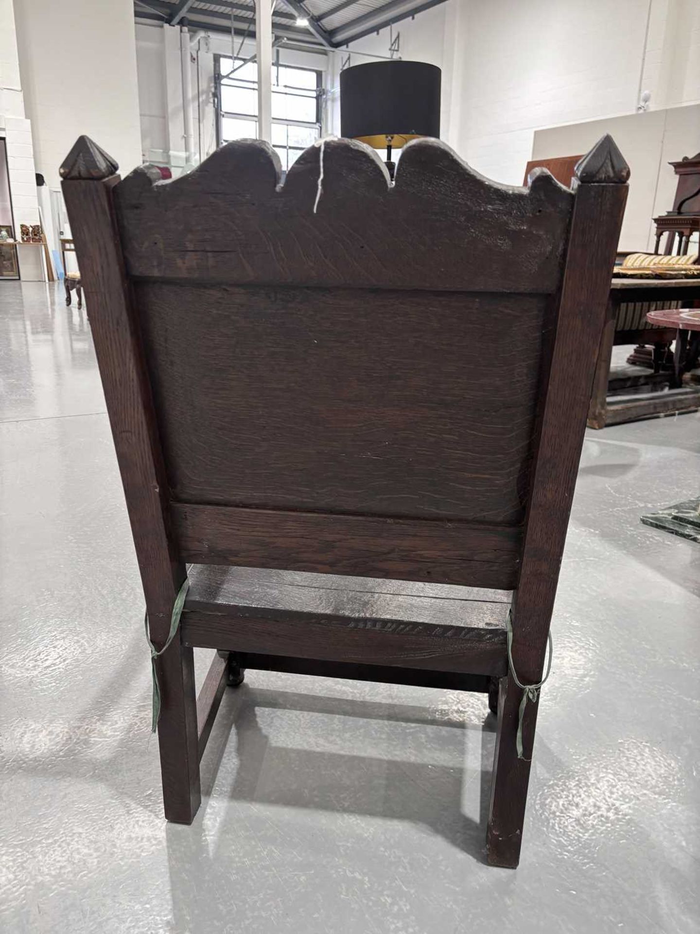 An oak wainscot armchair, 17th century and later, with carved decoration, the arms terminating in ca - Image 17 of 26