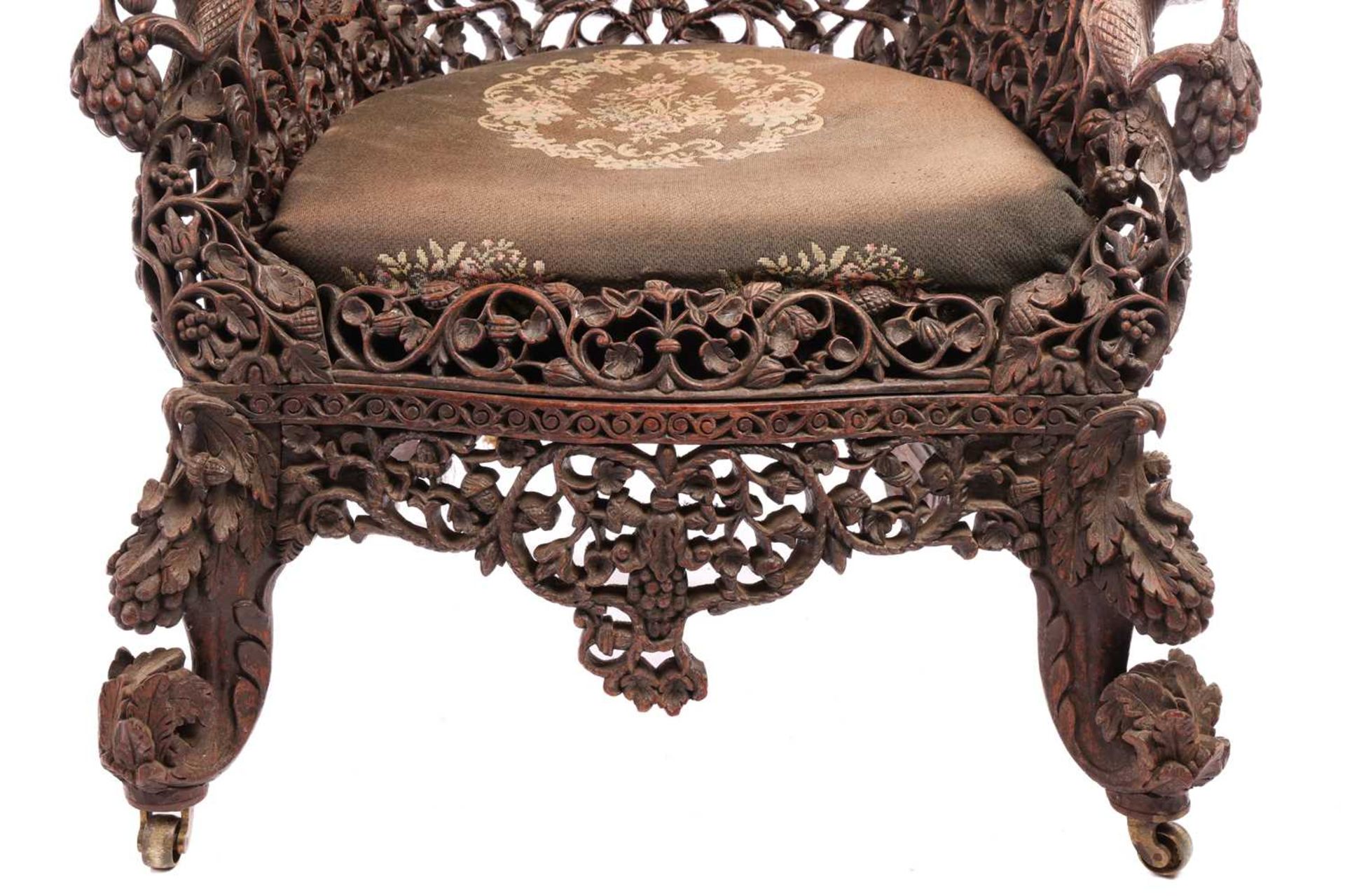 A Bombay Presidency carved rosewood arched back armchair, C1860s profusely carved with Indian strawb - Image 4 of 16
