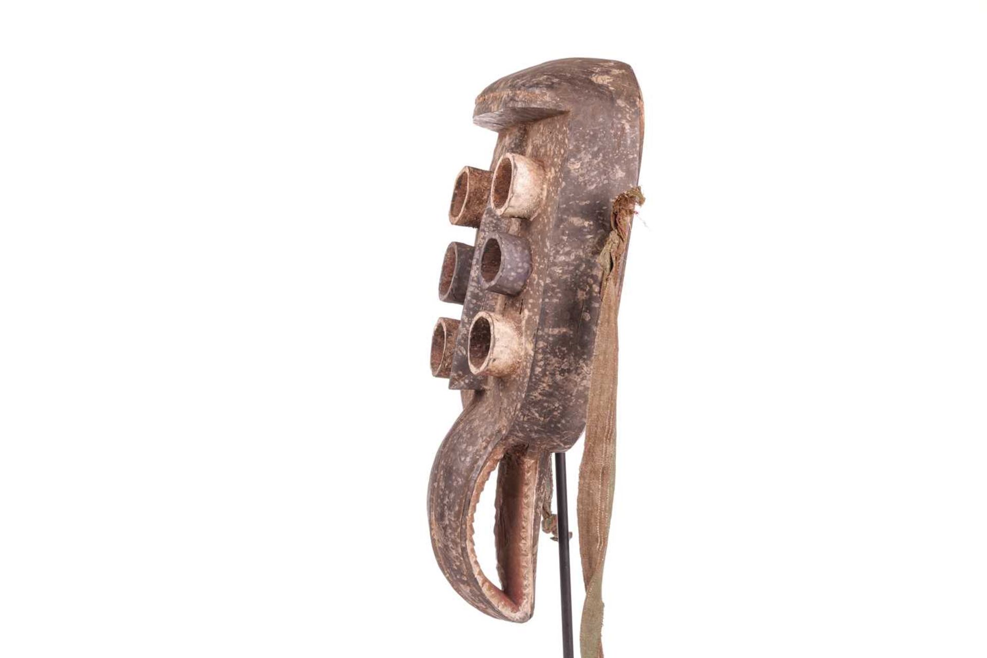 A Grebo ‘Kru’ mask, mid-20th century, 44 cm x 21 cm. NB: Display stand is for illustrative purposes  - Image 2 of 7