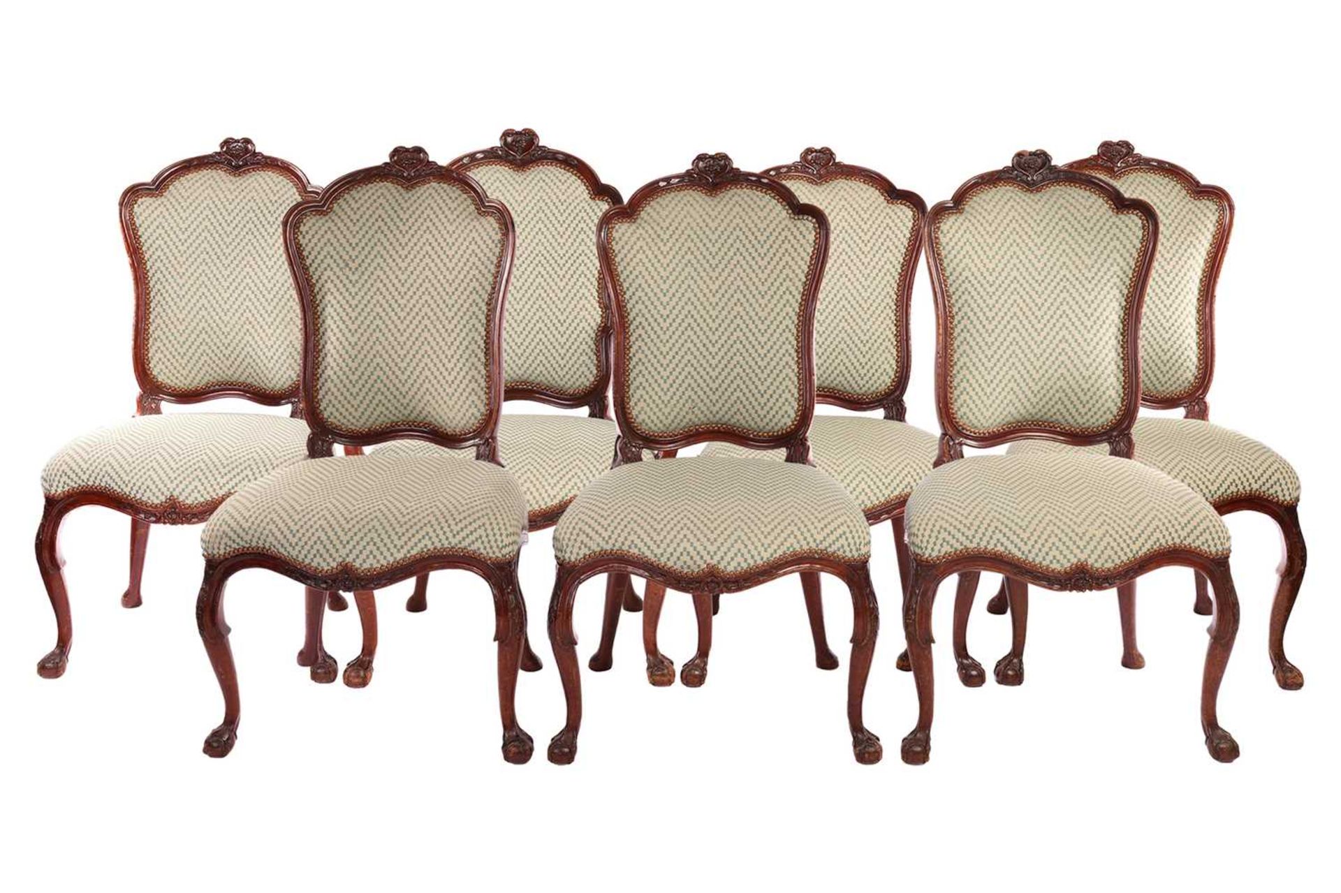 A set of seven George II style walnut cartouch backed dining chairs, possibly Irish C1900, the set c