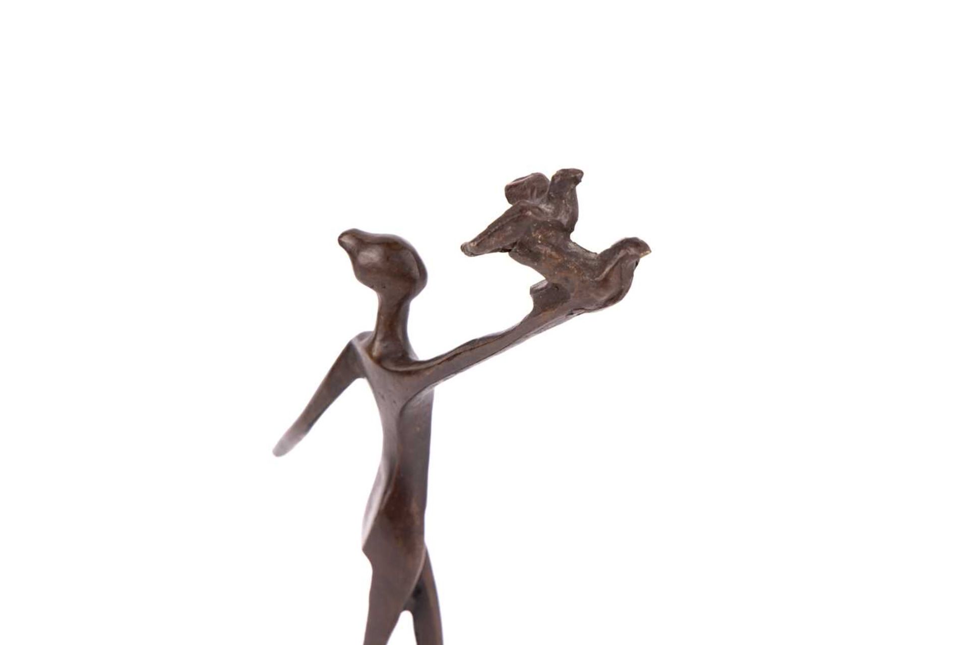 Razia Gershon (b.1931) Israeli, an abstract patinated bronze figure of a woman with two doves, prese - Image 4 of 4