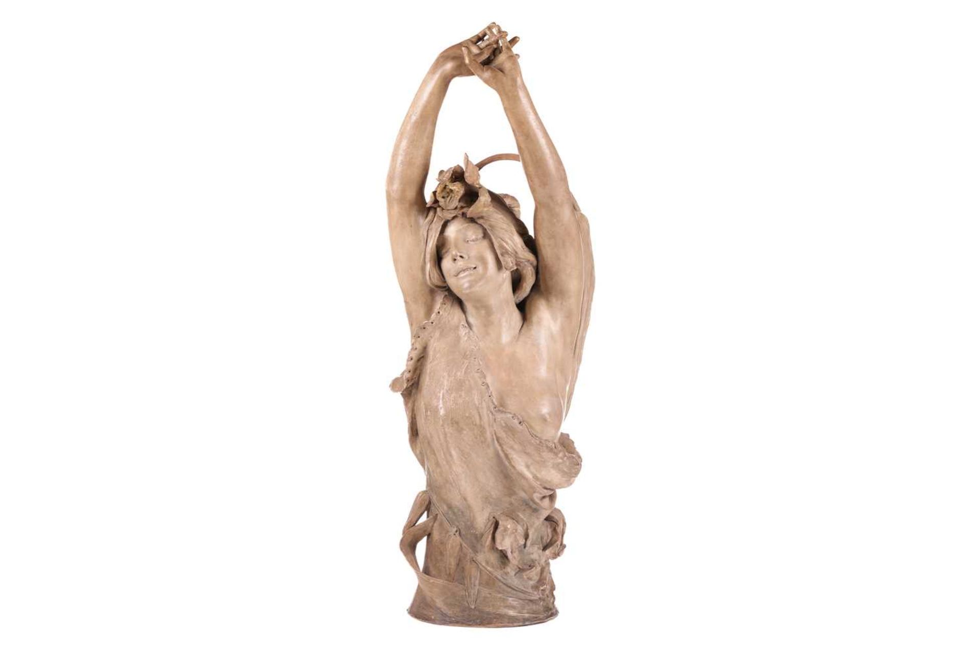 A large Art Nouveau earthenware figure, in the manner of Goldscheider, formed as a semi-nude female 