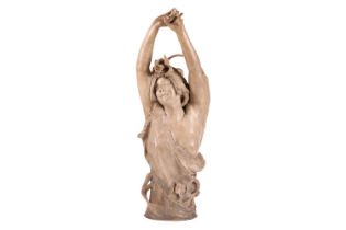 A large Art Nouveau earthenware figure, in the manner of Goldscheider, formed as a semi-nude female 