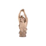 A large Art Nouveau earthenware figure, in the manner of Goldscheider, formed as a semi-nude female 