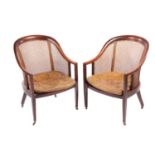 A pair of George IV-style mahogany horseshoe-backed bergerer salon armchairs, 20th-century, each wit